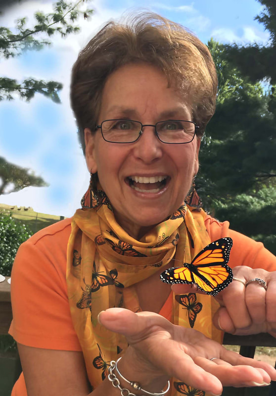 Lynn Rosenblatt holding a Monarch Butterfly